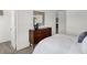 Bedroom featuring a wooden dresser, contemporary mirror, and view into an adjoining closet at 995 Penrose Pl, Danville, IN 46122