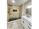 Luxurious bathroom with tiled shower, modern vanity, and elegant fixtures at 1001 N 14Th St, Elwood, IN 46036