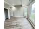 Neutral bedroom with hardwood floors, two windows, and white trim at 1001 N 14Th St, Elwood, IN 46036