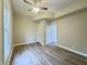 Cozy bedroom with hardwood floors, a ceiling fan, and natural light from the windows at 1001 N 14Th St, Elwood, IN 46036