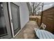 Cozy back patio with a small table and chairs, perfect for enjoying outdoor relaxation at 1008 E Apple Lake Dr, Greenfield, IN 46140