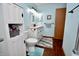 Well-lit bathroom with a modern vanity, mirror, and a charming, light blue accent wall at 1008 E Apple Lake Dr, Greenfield, IN 46140