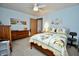 Bright bedroom boasts a quilt-covered bed, neutral walls, and matching dressers at 1008 E Apple Lake Dr, Greenfield, IN 46140