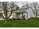 Charming single-story home with well-manicured lawn and inviting front porch at 1008 E Apple Lake Dr, Greenfield, IN 46140