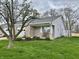 Charming single-story home with well-manicured lawn and inviting front porch at 1008 E Apple Lake Dr, Greenfield, IN 46140