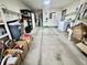 Spacious garage with concrete flooring, shelving, and a washing machine and dryer at 1008 E Apple Lake Dr, Greenfield, IN 46140