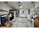 Spacious garage with concrete flooring, shelving, washing machine, dryer and overhead lighting at 1008 E Apple Lake Dr, Greenfield, IN 46140
