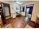 Well-lit kitchen featuring wood floors and access to dining and living areas at 1008 E Apple Lake Dr, Greenfield, IN 46140