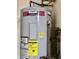 American Proline commercial grade water heater with visible connections and energy guide label at 1008 E Apple Lake Dr, Greenfield, IN 46140