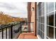 Relaxing outdoor balcony showcasing brick detail and neighborhood view at 1057 3Rd Nw Ave, Carmel, IN 46032