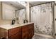 Elegant bathroom features a double sink vanity and a shower/tub combination with modern fixtures at 1057 3Rd Nw Ave, Carmel, IN 46032