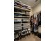 Walk-in closet offers ample storage with shelving and rods for organization and convenience at 1057 3Rd Nw Ave, Carmel, IN 46032