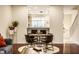 Charming dining area with round table and modern chairs next to an open kitchen at 1057 3Rd Nw Ave, Carmel, IN 46032