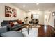 Open-concept living space with a comfortable seating arrangement and adjacent dining area at 1057 3Rd Nw Ave, Carmel, IN 46032