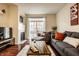 Inviting living room with a fireplace, plush seating, and a stylish wooden coffee table at 1057 3Rd Nw Ave, Carmel, IN 46032
