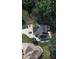 Aerial view of home shows large lot, mature trees, and driveway space at 1066 N Dogwood Way, Greenfield, IN 46140