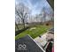 Backyard view from the home's roof overlooking the deck, grassy area, and a red storage shed at 1066 N Dogwood Way, Greenfield, IN 46140