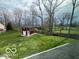 Backyard features a barn for storage and green space at 1066 N Dogwood Way, Greenfield, IN 46140