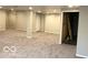 Spacious basement featuring gray carpet and an unfinished storage area at 1066 N Dogwood Way, Greenfield, IN 46140