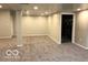 A large basement with neutral paint and recessed lighting at 1066 N Dogwood Way, Greenfield, IN 46140