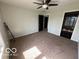 Spacious bedroom with dark doors, a fan and natural light at 1066 N Dogwood Way, Greenfield, IN 46140
