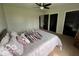 Bedroom featuring a bed with decorative pillows and dark closets at 1066 N Dogwood Way, Greenfield, IN 46140