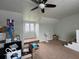 Bright bonus room with a ceiling fan and sky lights at 1066 N Dogwood Way, Greenfield, IN 46140