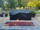 Outdoor patio featuring a modern rectangular firepit providing warmth and a focal point for gatherings at 1066 N Dogwood Way, Greenfield, IN 46140