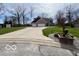 Beautiful home with a long driveway and a spacious two-car garage on a well maintained lawn at 1066 N Dogwood Way, Greenfield, IN 46140
