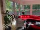 Sunroom featuring outdoor seating, bright lighting, and views of the outdoors at 1066 N Dogwood Way, Greenfield, IN 46140