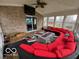 Sunroom complete with brick accent wall, fireplace, and large seating arrangement at 1066 N Dogwood Way, Greenfield, IN 46140