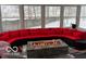 Cozy sunroom featuring an outdoor seating arrangement, fireplace, and view of snowy landscape at 1066 N Dogwood Way, Greenfield, IN 46140
