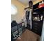 Custom walk-in closet featuring dark wood cabinetry and a variety of storage solutions at 1066 N Dogwood Way, Greenfield, IN 46140