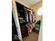 Well-organized walk-in closet with built-in shelving and hanging racks for ample storage at 1066 N Dogwood Way, Greenfield, IN 46140