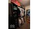 Organized walk-in closet featuring dark wood shelving and racks, providing ample storage at 1066 N Dogwood Way, Greenfield, IN 46140