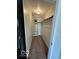 Neutral walk-in closet has ladder for storage at 1066 N Dogwood Way, Greenfield, IN 46140