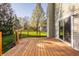 Spacious wooden back deck offers a great space for outdoor living and entertaining with sliding door entry at 10775 Northhampton Dr, Fishers, IN 46038