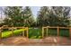 A gorgeous backyard view with a fire pit, lawn, and wooden fence at 10775 Northhampton Dr, Fishers, IN 46038