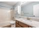 A bathroom with a single sink vanity, bath tub, and a medicine cabinet at 10775 Northhampton Dr, Fishers, IN 46038
