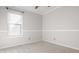 This bedroom has a large window providing great natural light and neutral carpeting at 10775 Northhampton Dr, Fishers, IN 46038