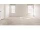 Spacious bedroom with neutral colored walls, two windows, and plush carpeting at 10775 Northhampton Dr, Fishers, IN 46038