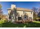 Back exterior view highlighting the deck, windows, and light green siding at 10775 Northhampton Dr, Fishers, IN 46038