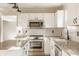Kitchen featuring stainless steel appliances, granite countertops and white cabinetry at 10775 Northhampton Dr, Fishers, IN 46038