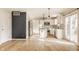 Eat-in kitchen featuring white cabinetry, stainless appliances, and hardwood floors at 10775 Northhampton Dr, Fishers, IN 46038