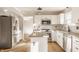Spacious kitchen featuring stainless steel appliances, granite countertops and white cabinetry at 10775 Northhampton Dr, Fishers, IN 46038