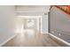 Bright living room featuring hardwood floors, staircase, and neutral color palette at 10775 Northhampton Dr, Fishers, IN 46038