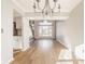 Bright living room featuring hardwood floors, staircase, and neutral color palette at 10775 Northhampton Dr, Fishers, IN 46038