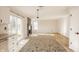 Open living room with fireplace, new flooring, sliding glass door, and natural light at 10775 Northhampton Dr, Fishers, IN 46038