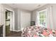 Bright bedroom featuring a window, closet, and access to ensuite bathroom at 10839 Cedar Pine Dr, Indianapolis, IN 46235