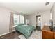 Comfortable bedroom with ample natural light, ensuite bathroom, and modern finishes at 10839 Cedar Pine Dr, Indianapolis, IN 46235